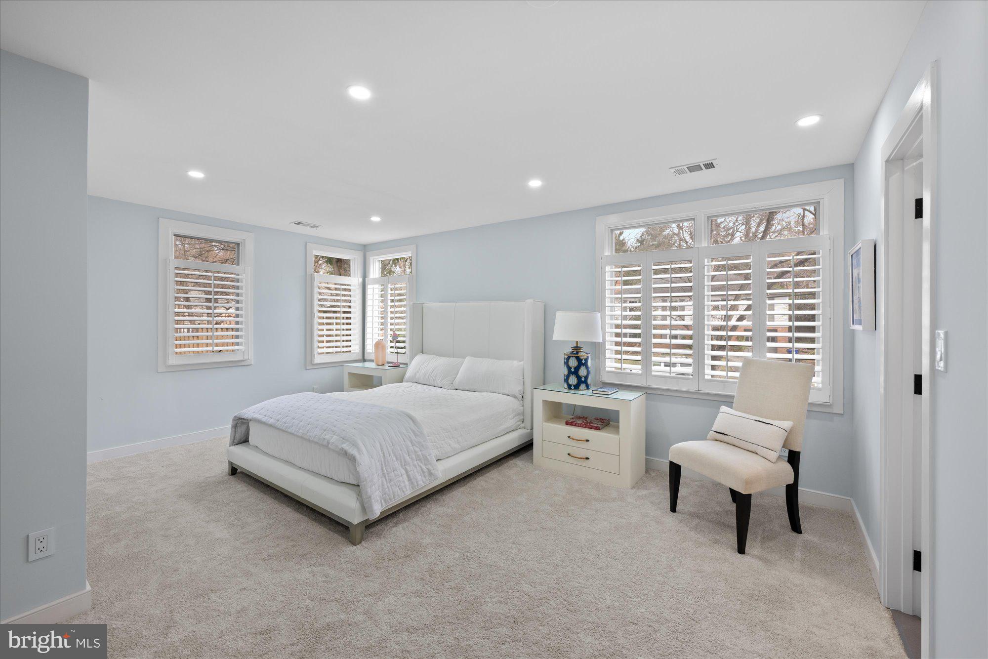 6700 Rannoch Road Bethesda, MD 20817 - Photo 20 of 36 a spacious bedroom with a bed and a couch