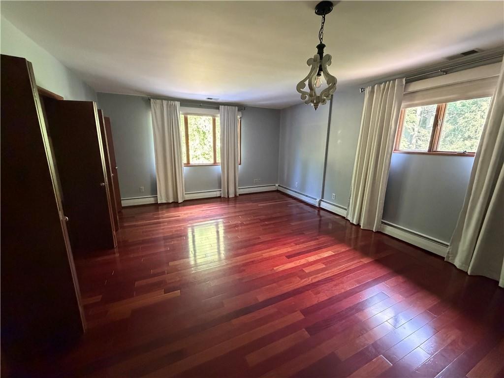 3137 Harts Run Road Allison Park, PA 15101 - Photo 8 of 11 an empty room with wooden floor and windows