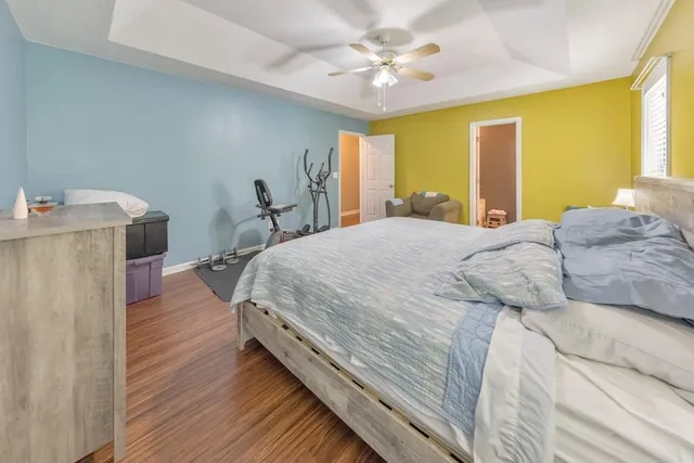 a bed room with a bed and a chandelier