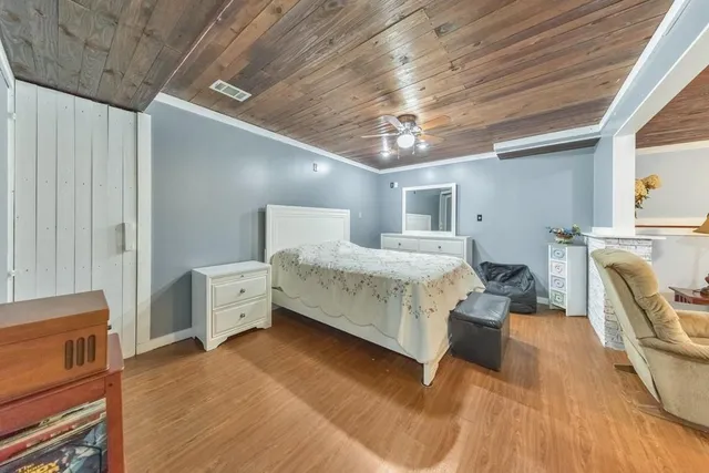 a bed room with furniture and a chandelier