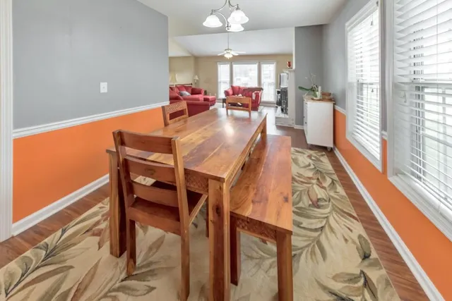 a view of a dining room with furniture window and outside view