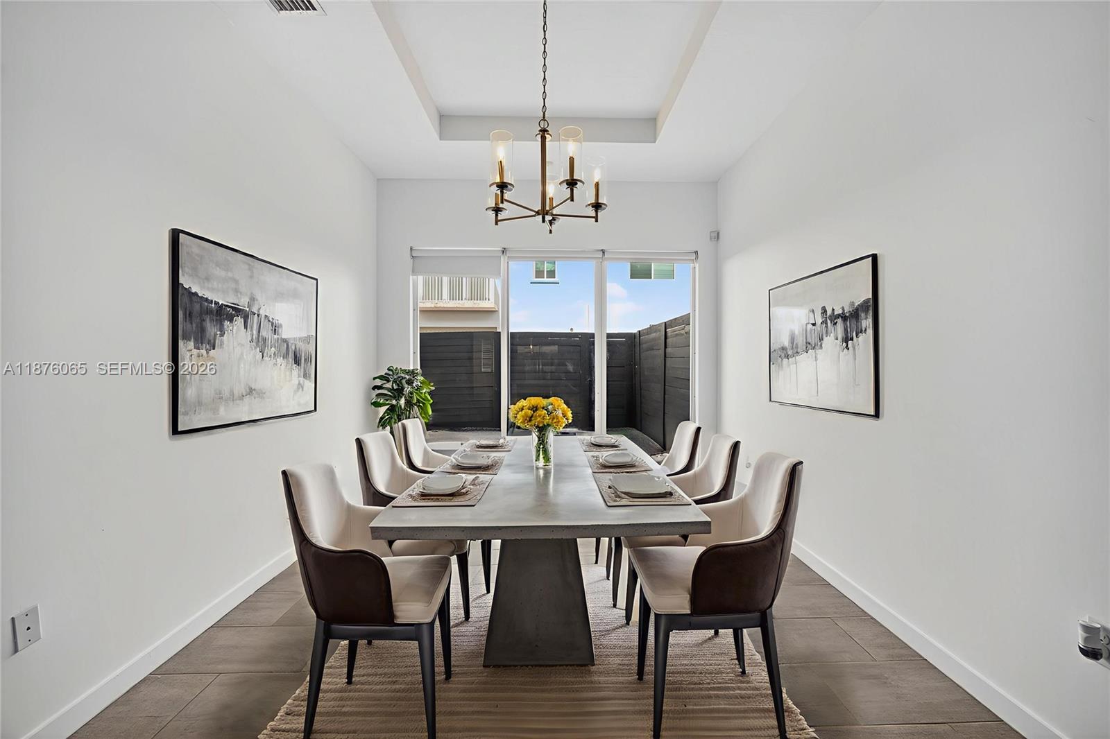 17606 Southwest 149th Place, Unit 17606 Miami, FL 33187 - Photo 15 of 69 a dining room with furniture and window