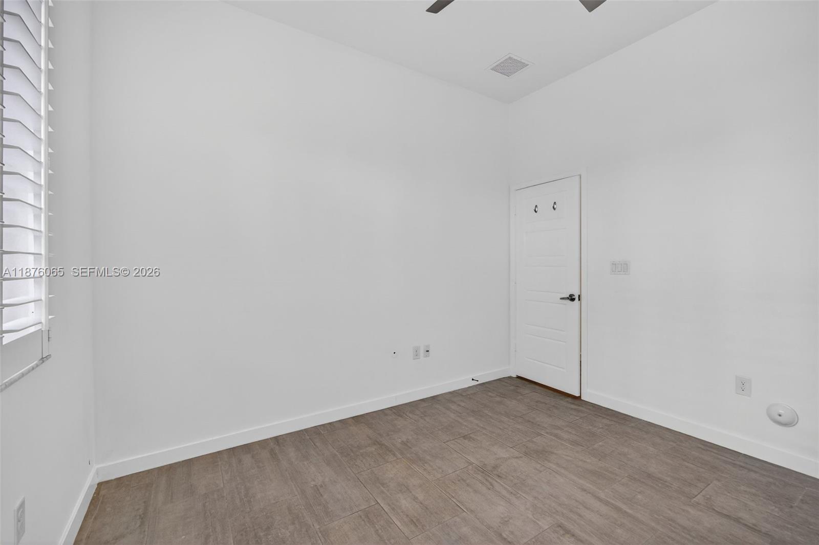 17606 Southwest 149th Place, Unit 17606 Miami, FL 33187 - Photo 24 of 69 a view of an empty room