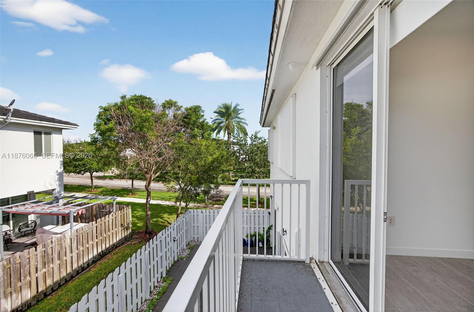 17606 Southwest 149th Place, Unit 17606 Miami, FL 33187 - Photo 36 of 69 a view of balcony and yard