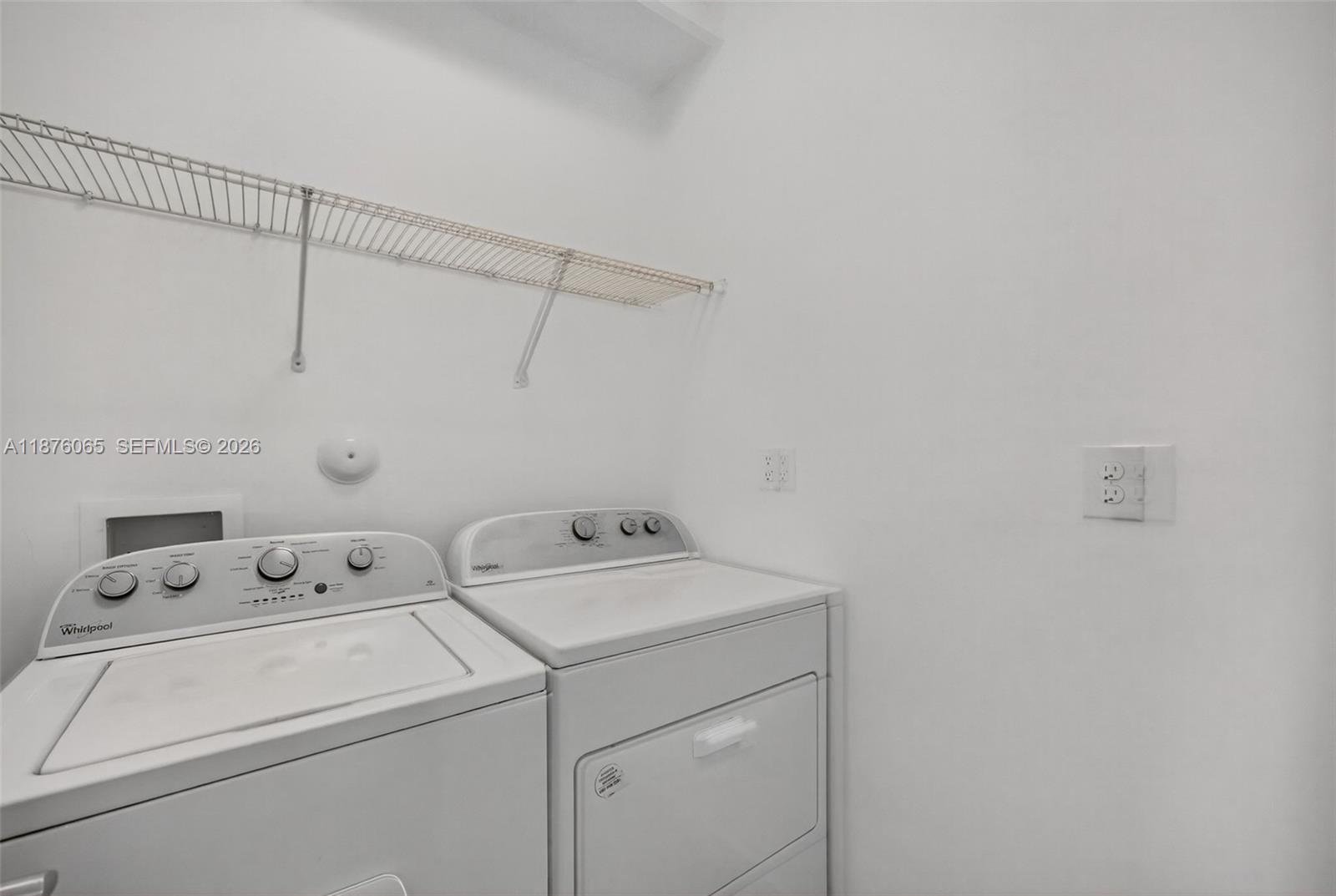 17606 Southwest 149th Place, Unit 17606 Miami, FL 33187 - Photo 38 of 69 a utility room with dryer and washer