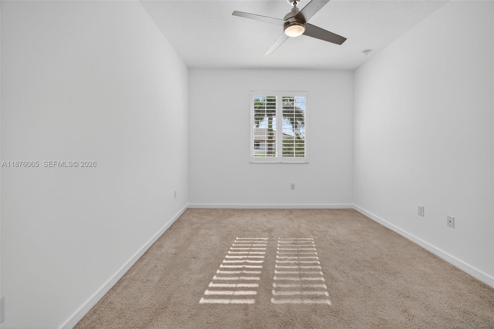 17606 Southwest 149th Place, Unit 17606 Miami, FL 33187 - Photo 42 of 69 an empty room with a window