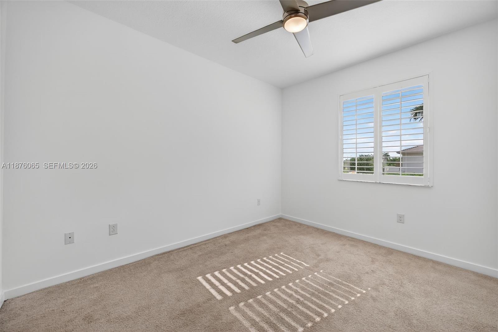 17606 Southwest 149th Place, Unit 17606 Miami, FL 33187 - Photo 45 of 69 a view of an empty room with a window