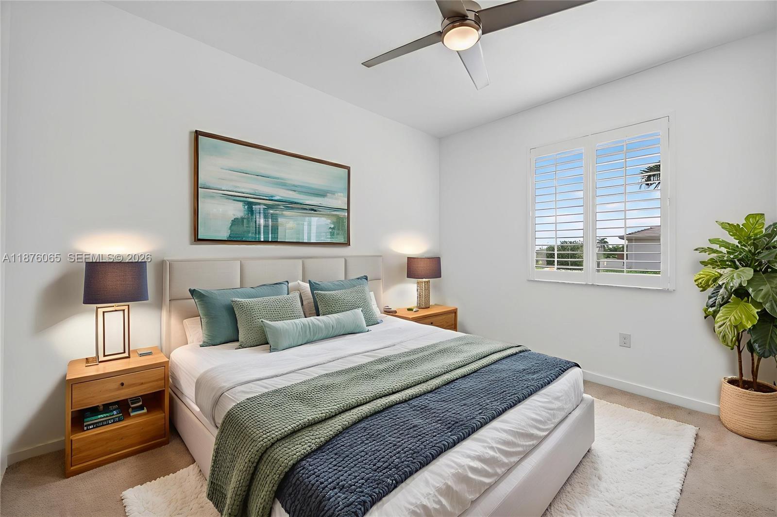 17606 Southwest 149th Place, Unit 17606 Miami, FL 33187 - Photo 46 of 69 a bedroom with a bed and a window
