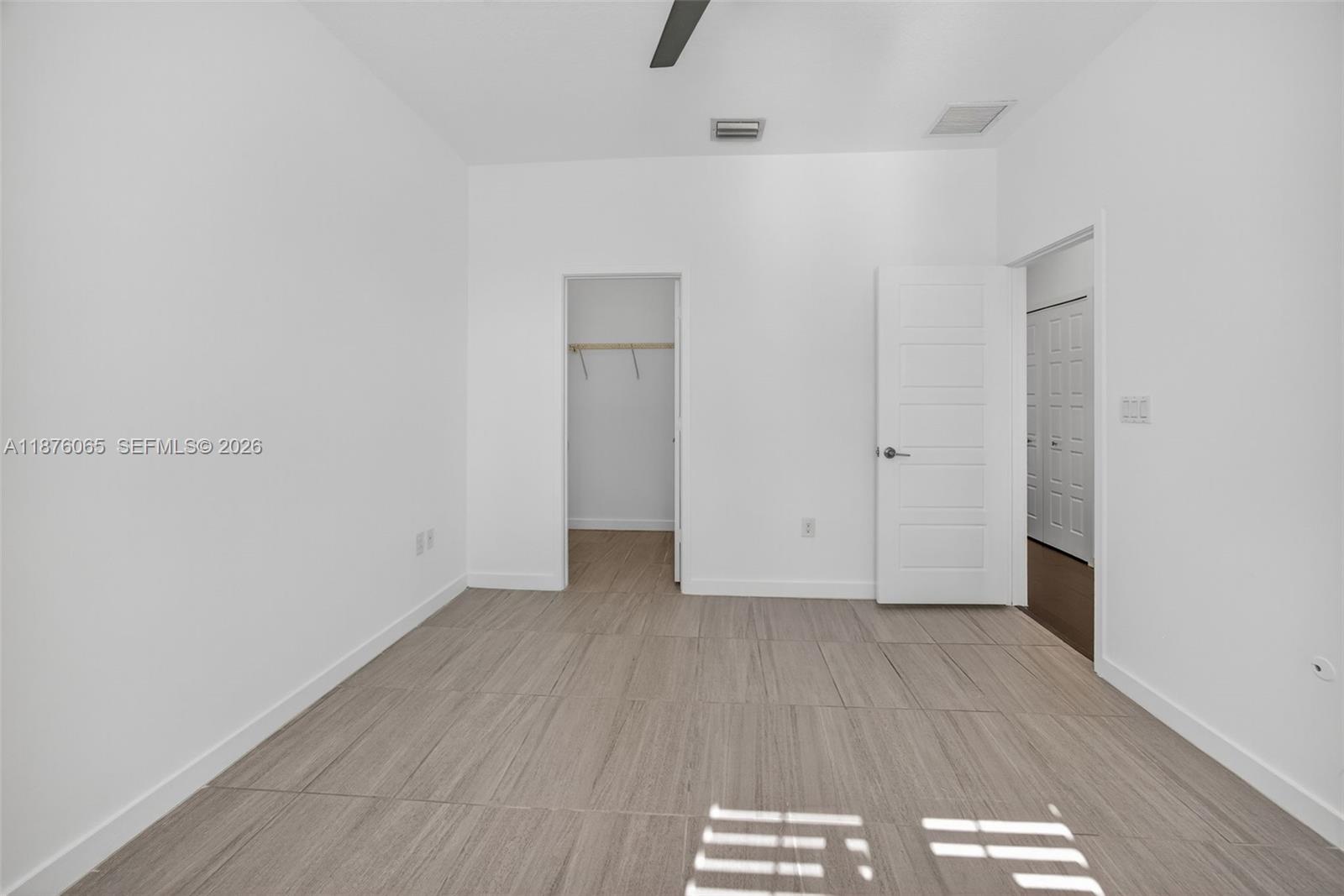 17606 Southwest 149th Place, Unit 17606 Miami, FL 33187 - Photo 50 of 69 a view of a livingroom with wooden floor