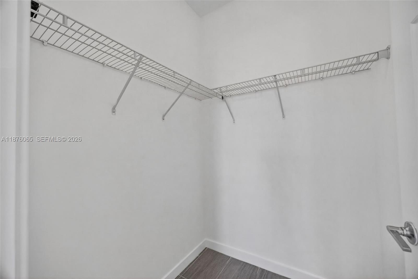 17606 Southwest 149th Place, Unit 17606 Miami, FL 33187 - Photo 51 of 69 a view of a room with racks on the wall