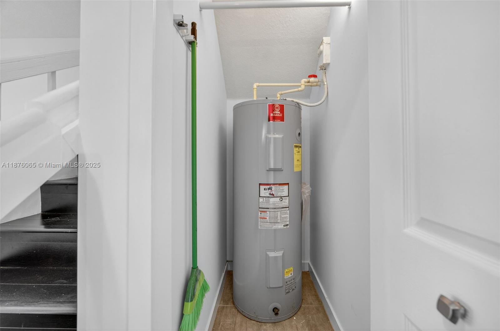 17606 Southwest 149th Place, Unit 17606 Miami, FL 33187 - Photo 53 of 69 Water heater Closet, 1st Level