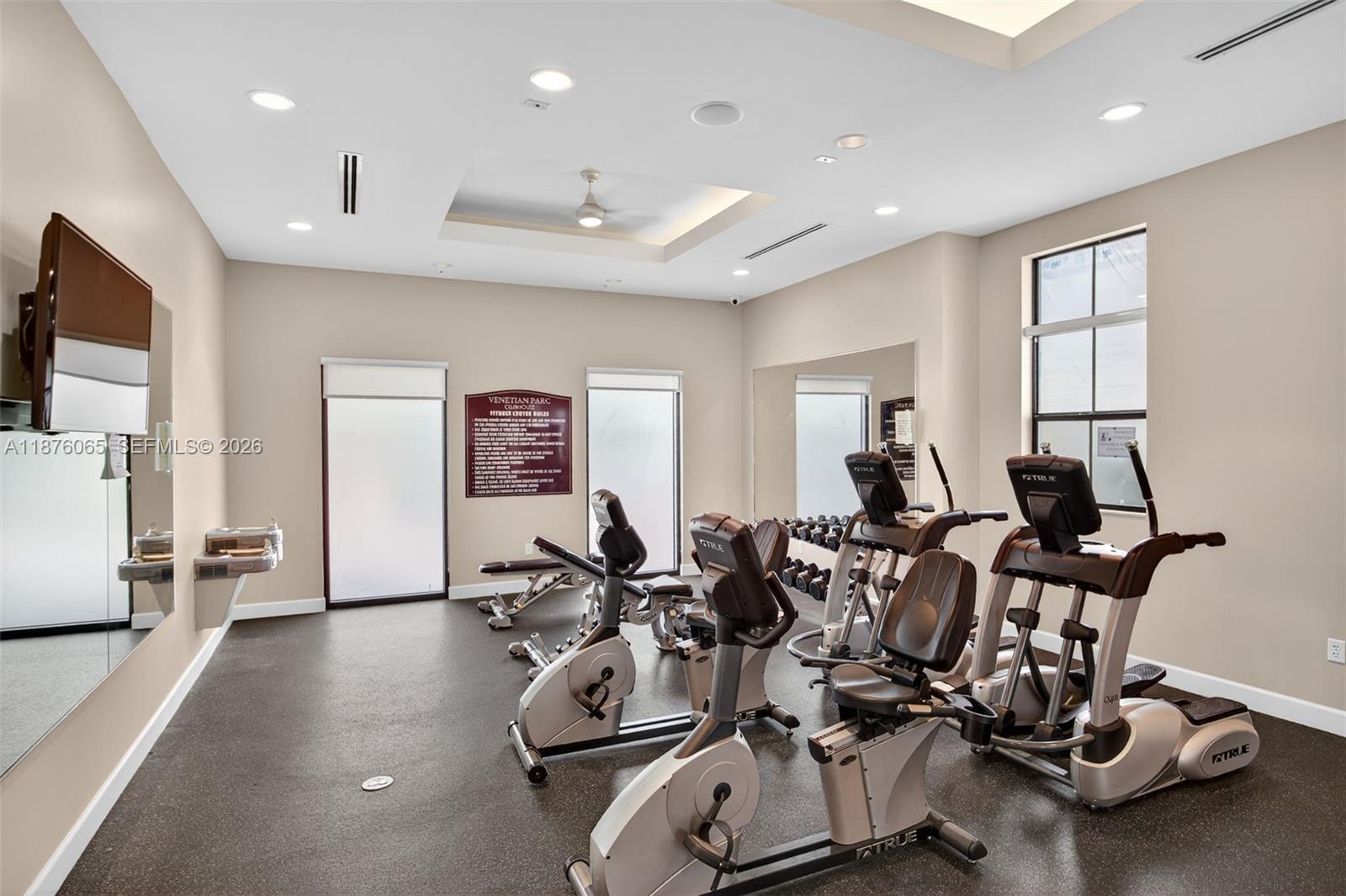17606 Southwest 149th Place, Unit 17606 Miami, FL 33187 - Photo 63 of 69 a view of a room with gym equipment