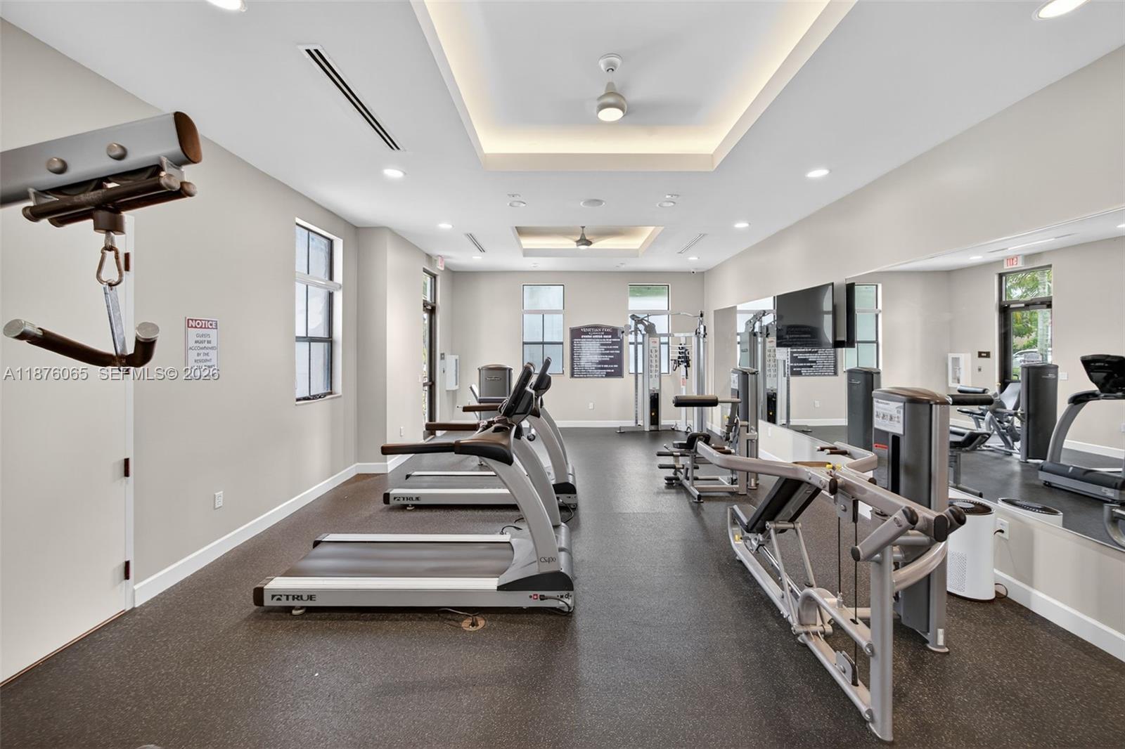 17606 Southwest 149th Place, Unit 17606 Miami, FL 33187 - Photo 64 of 69 a view of a room with gym equipment