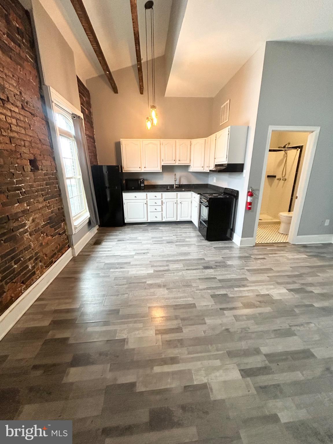 a view of a kitchen with a sink
