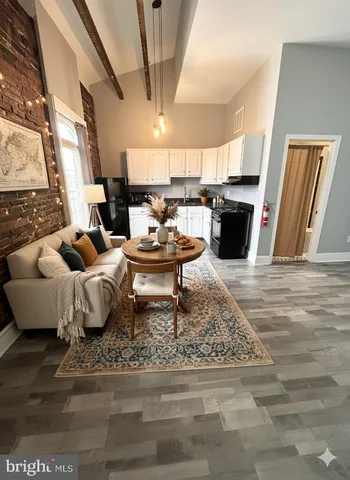 a living room with furniture and a rug