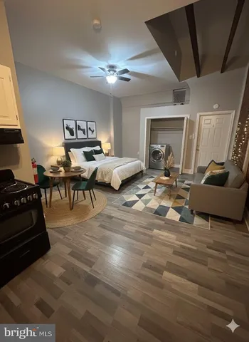 a living room with furniture and a piano