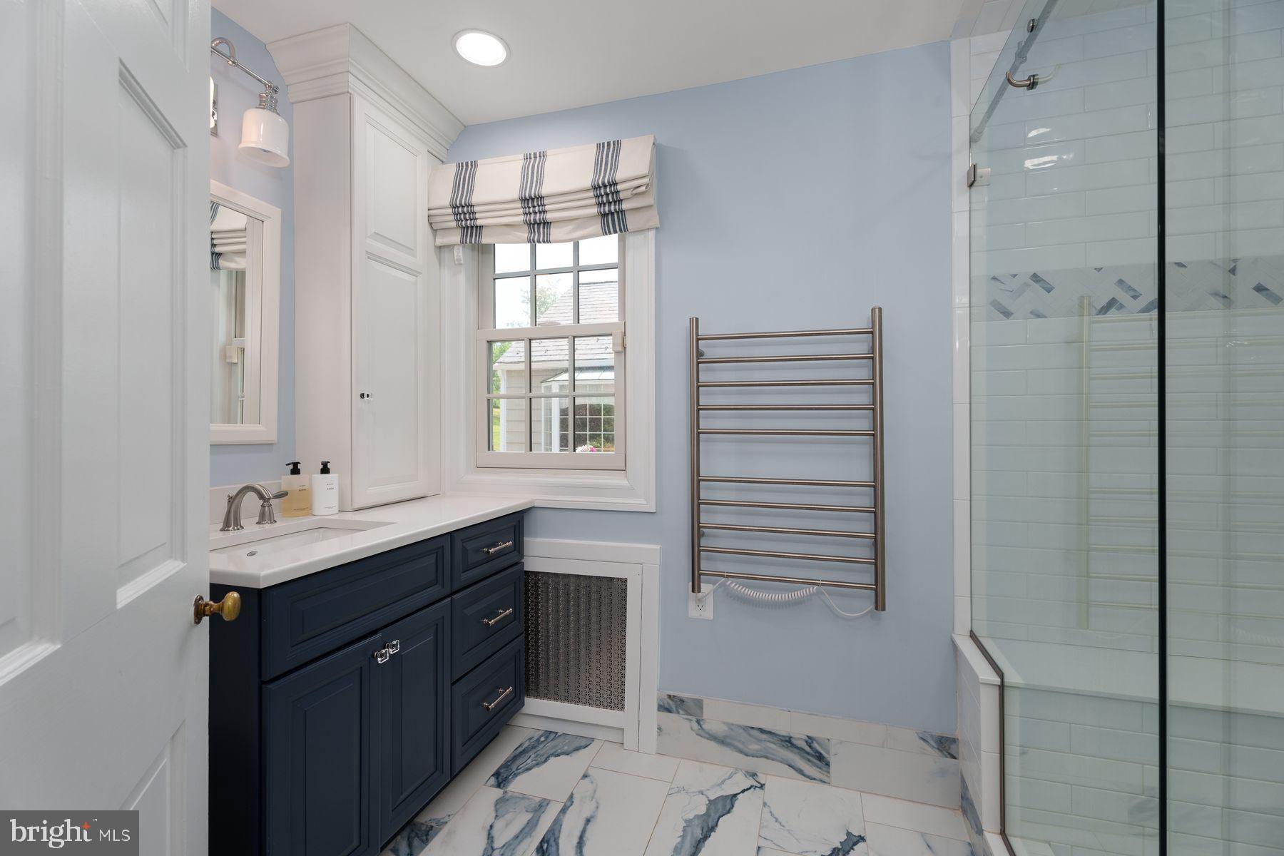 821 Pretty Brook Road Princeton, NJ 08540 - Photo 19 of 32 a bathroom with a sink shower and a mirror