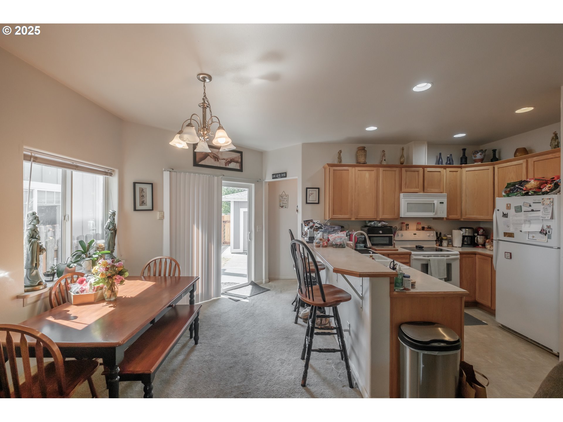 1036 9th Street Florence, OR 97439 - Photo 12 of 47 a kitchen that has a table and chairs in it