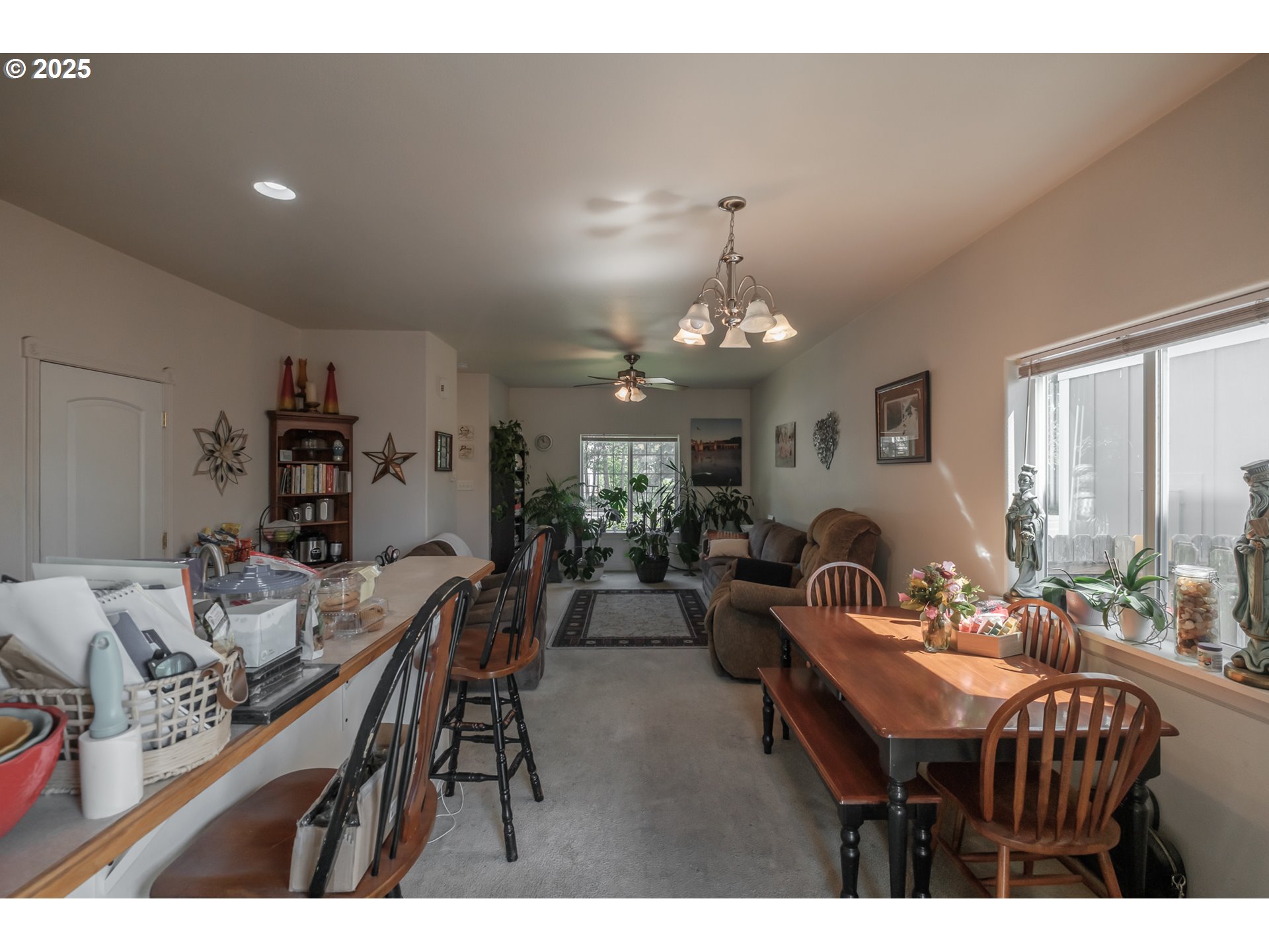 1036 9th Street Florence, OR 97439 - Photo 15 of 47 a view of a dining room with furniture and chandelier
