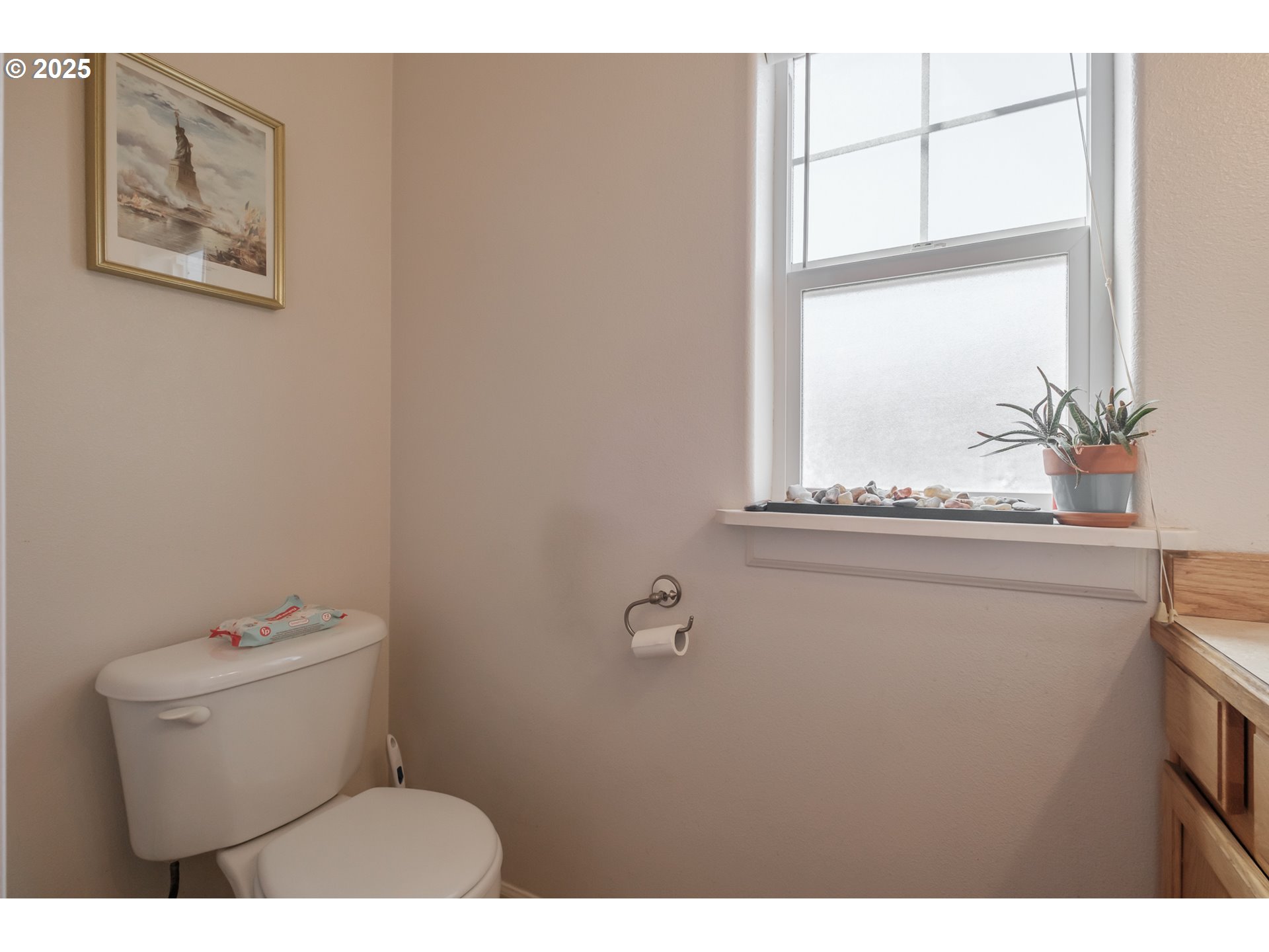 1036 9th Street Florence, OR 97439 - Photo 22 of 47 a bathroom with a toilet sink and mirror