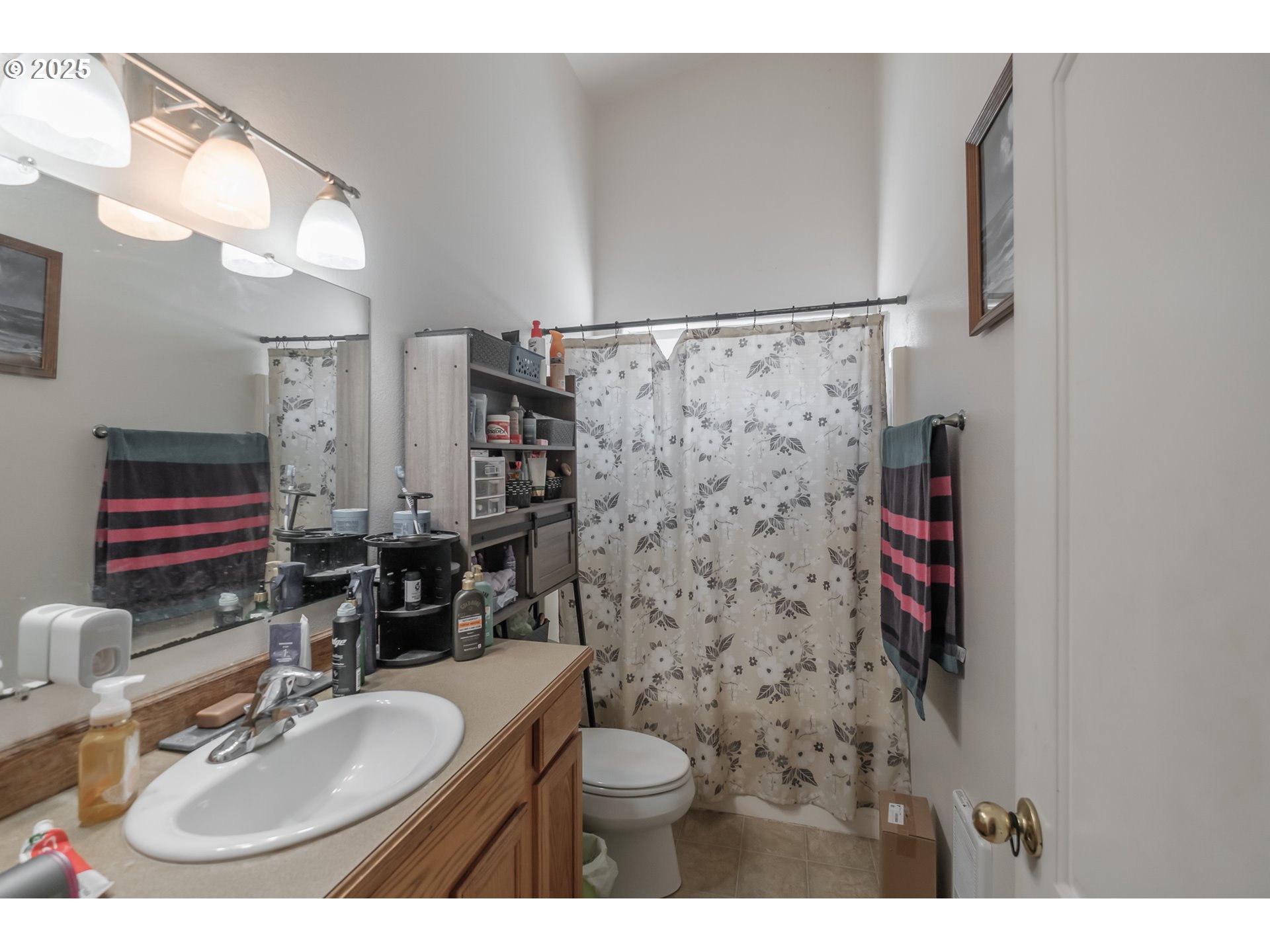 1036 9th Street Florence, OR 97439 - Photo 27 of 47 a bathroom with a sink vanity granite and a mirror