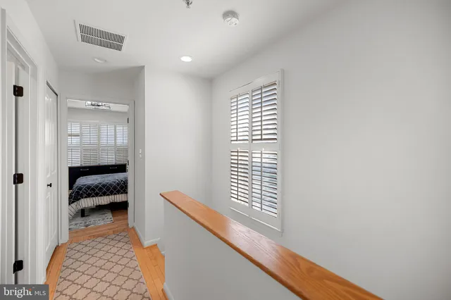 a bedroom with windows