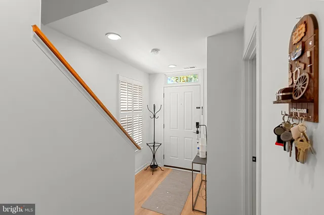 a view of an entryway with wooden floor
