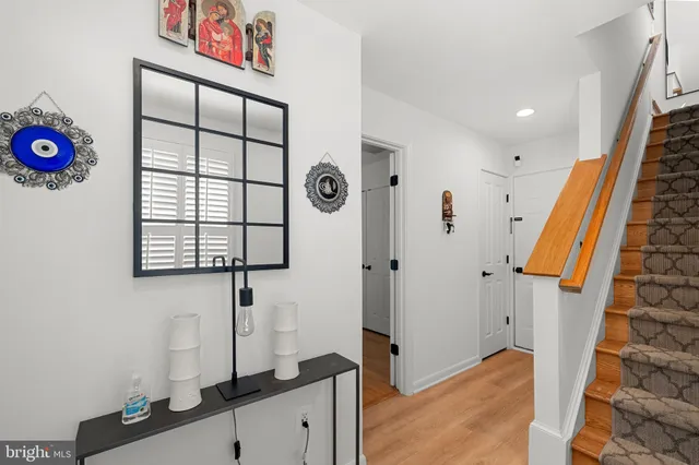 a view of an entryway with wooden floor