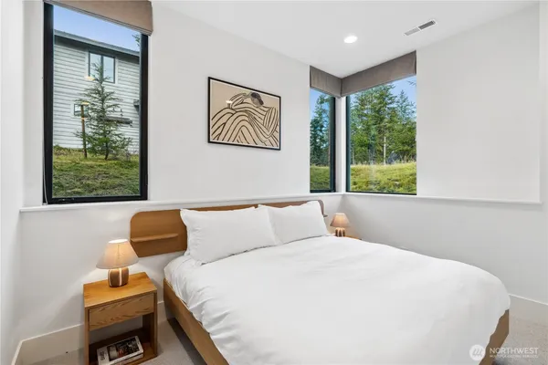 a bedroom with a bed and window