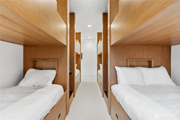 a bedroom with a bed and lamp