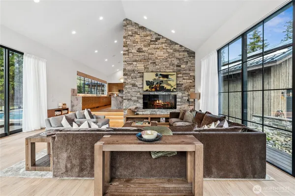 a living room with fireplace furniture and a flat screen tv