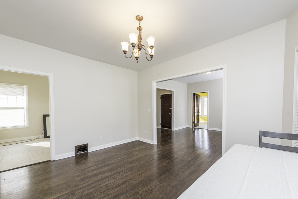 515 2nd Street, Unit 2 Waukegan, IL 60085 - Photo 11 of 27 a view of an empty room with window and wooden floor