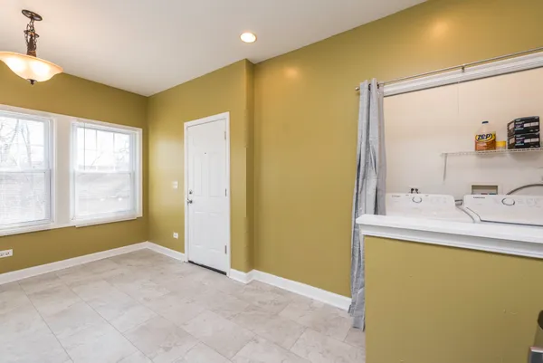 a bathroom with a sink mirror and a bathtub