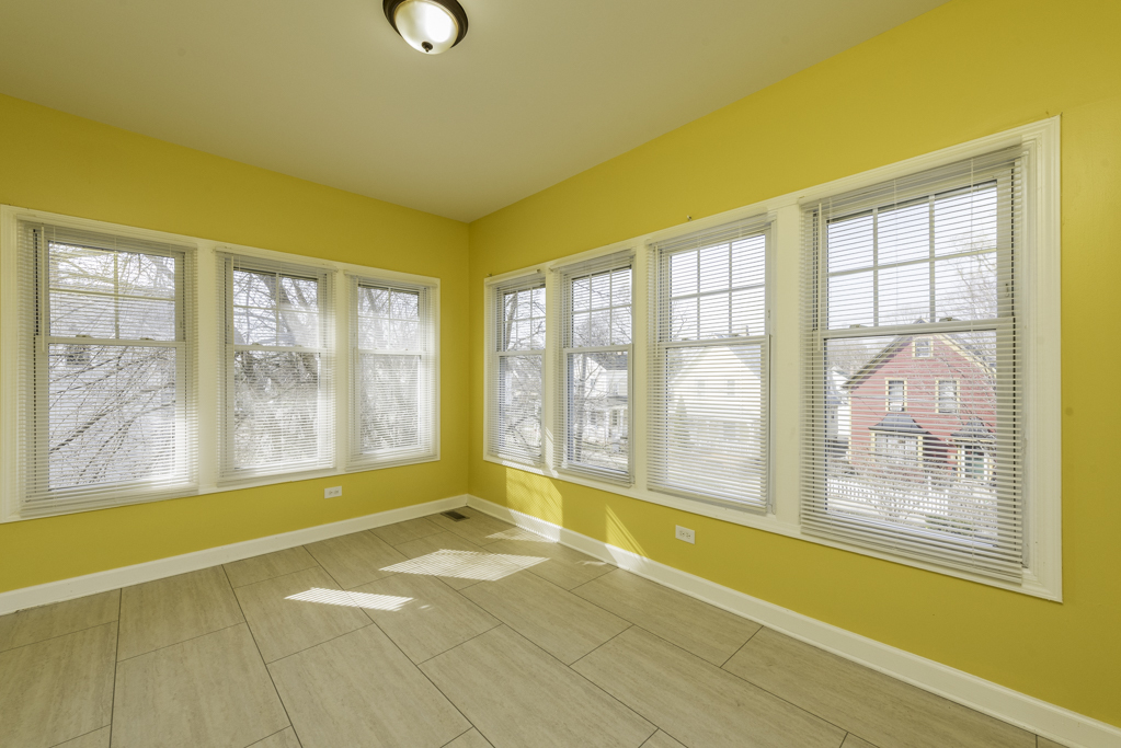 515 2nd Street, Unit 2 Waukegan, IL 60085 - Photo 22 of 27 a view of an empty room with a large window with kitchen view