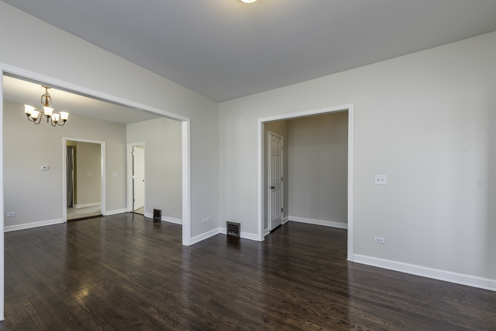 515 2nd Street, Unit 2 Waukegan, IL 60085 - Photo 5 of 27 a view of an empty room with wooden floor