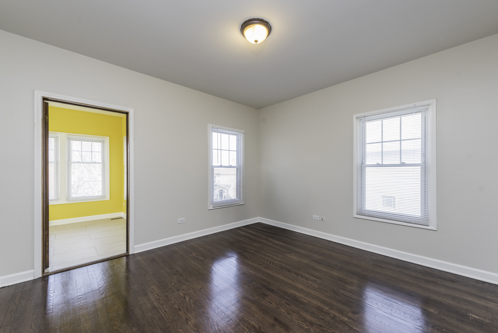 515 2nd Street, Unit 2 Waukegan, IL 60085 - Photo 7 of 27 a view of empty room with window and wooden floor