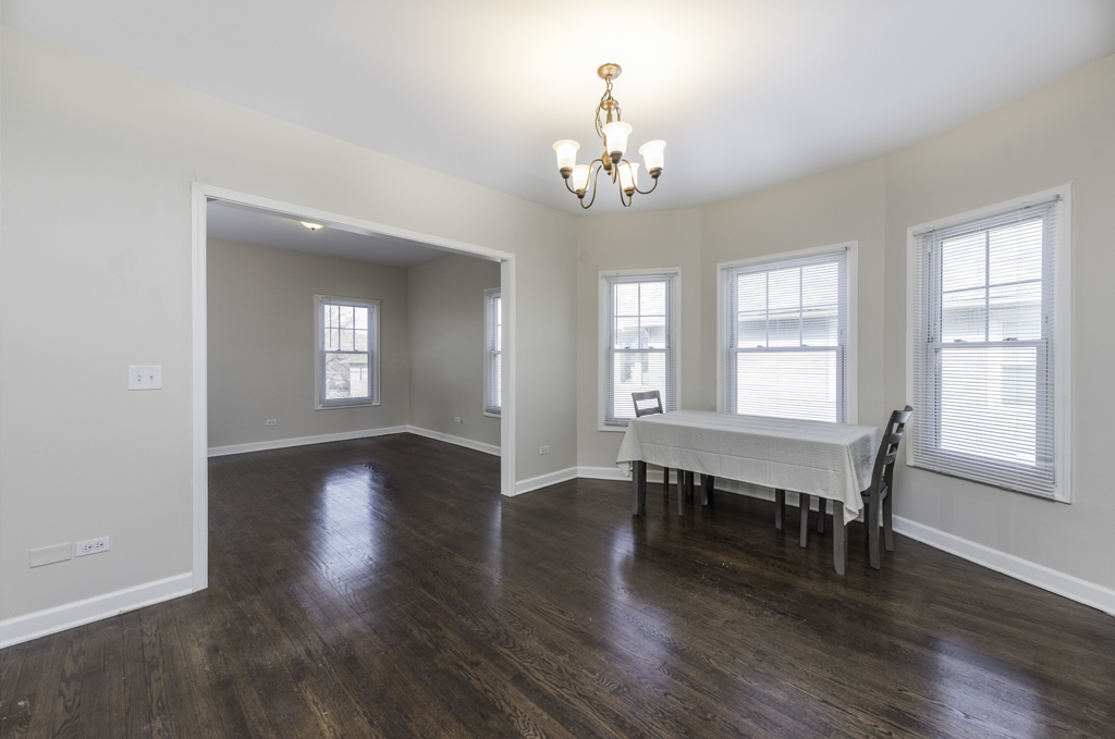 515 2nd Street, Unit 2 Waukegan, IL 60085 - Photo 9 of 27 a view of a room with wooden floor and windows