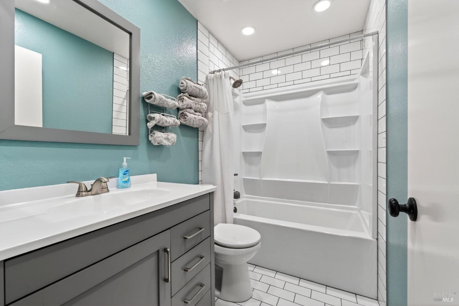 4526 Hillview Court Rohnert Park, CA 94928 - Photo 19 of 28 a bathroom with a sink a toilet and shower