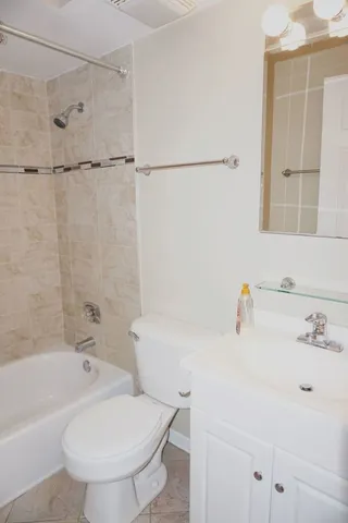 a view of an empty room and fire place