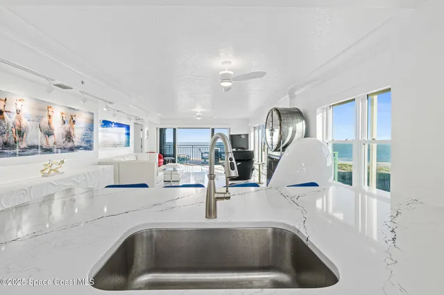 a kitchen with cabinets stainless steel appliances and a counter space