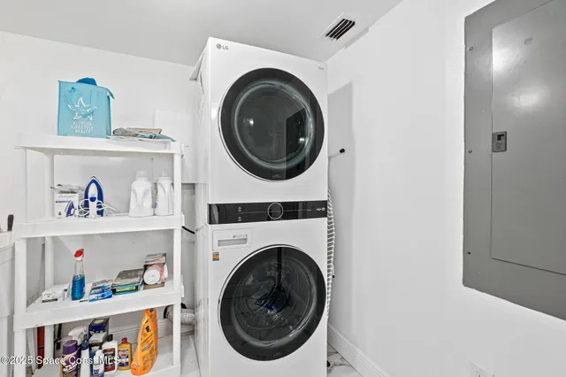 a view of a house with sitting area and swimming pool