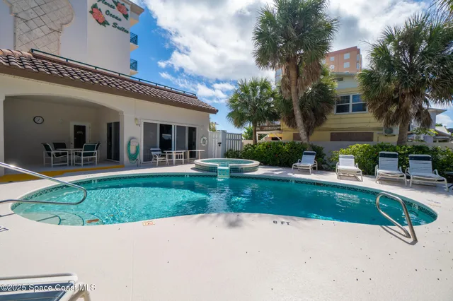 a view of a swimming pool with a patio