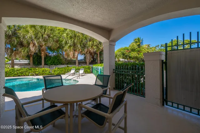 a view of a roof deck with wooden fence