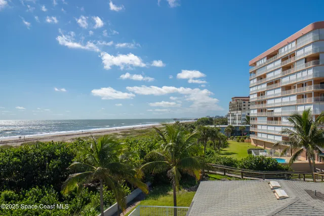 a view of a balcony with chairs