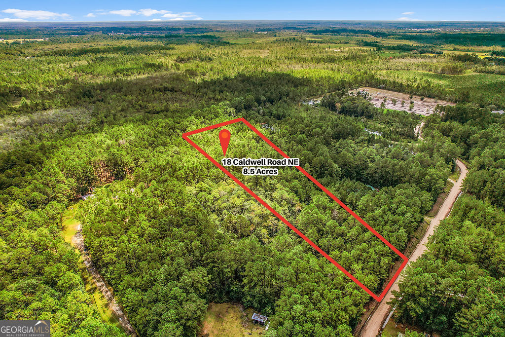 a view of a field with an ocean view