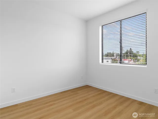 a bathroom with a sink toilet vanity and shower