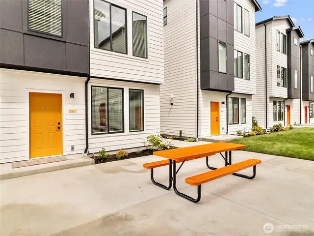a swimming pool with outdoor seating area