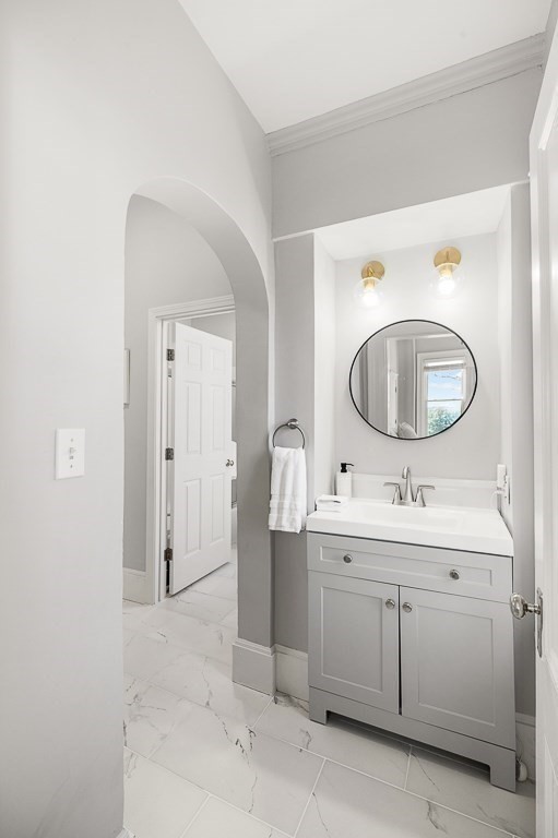 5 Babson Street, Unit 2 Gloucester, MA 01930 - Photo 18 of 30 a bathroom with a toilet a sink and a mirror