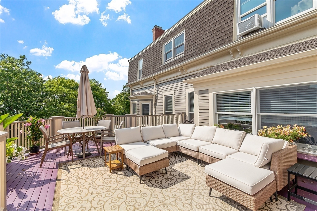 5 Babson Street, Unit 2 Gloucester, MA 01930 - Photo 3 of 30 a building outdoor space with patio furniture