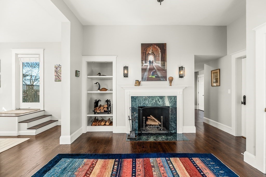 5 Babson Street, Unit 2 Gloucester, MA 01930 - Photo 8 of 30 a living room with furniture and a fireplace